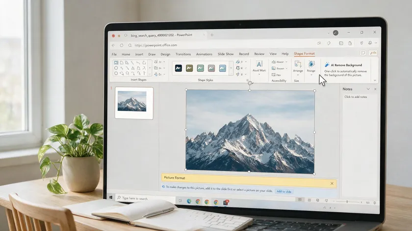 A laptop browser showing PowerPoint Online with the AI Remove Background button highlighted over a mountain photo.